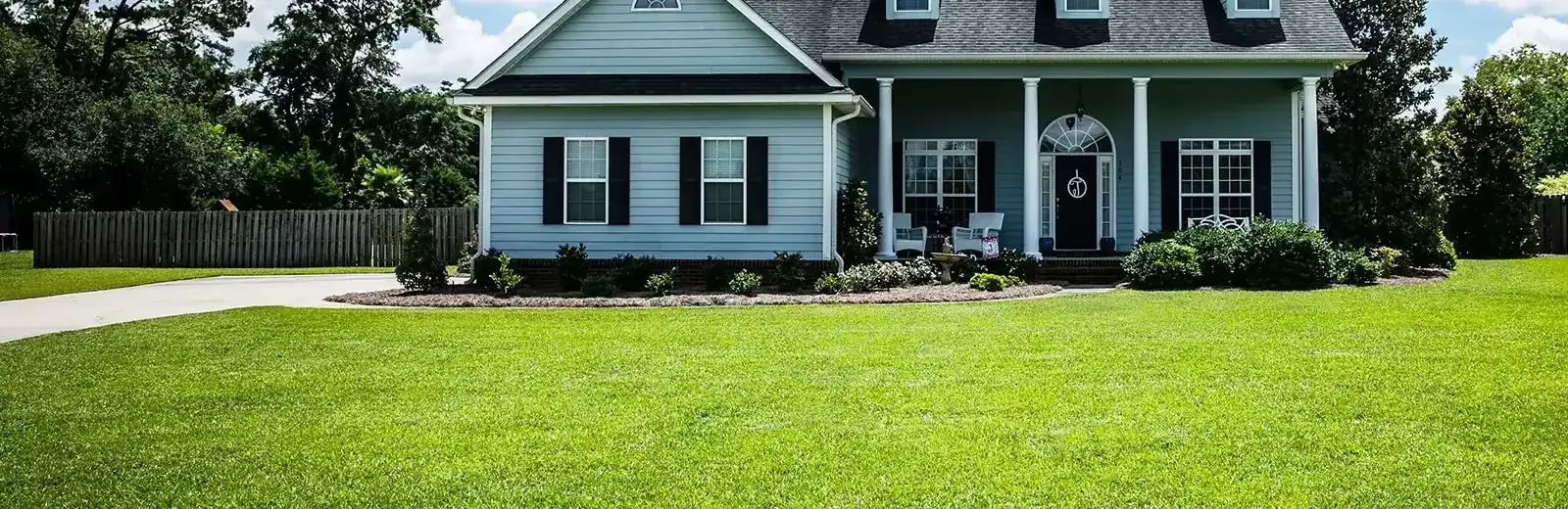 house with a weed-free green lawn